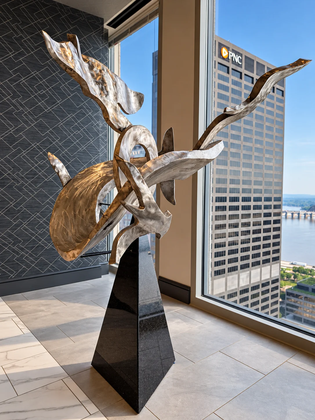 Eternal, a sculptural memorial with intertwined metallic forms in a sunlit Louisville interior